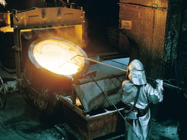 Laborers working in foundry.