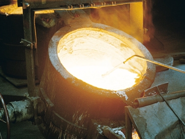 Laborers working in foundry.