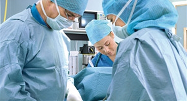 Anaesthesia nurse (nurse anesthesist), patient and anaesthesiologist during intravenous induction of anaesthesia. Operating room, Sabbatsberg Hospital, Stockholm